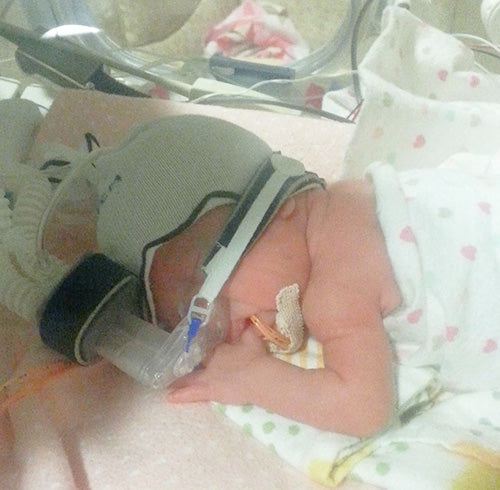 Daddy and His preemie daughter.